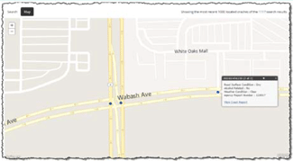 Map. More detailed crash map information from IDOT crash manager. Map showing an intersection in which there are two dots indicating crash reports submitted to IDOT. To the right is a third dot which has been selected. A pop-up window gives details for that crash report, including road surface conditions, if the crash was alcohol related, the weather conditions, and an agency report number.