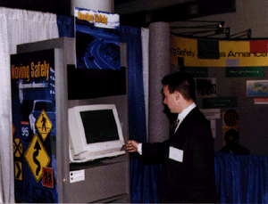 Man in suit using kiosk