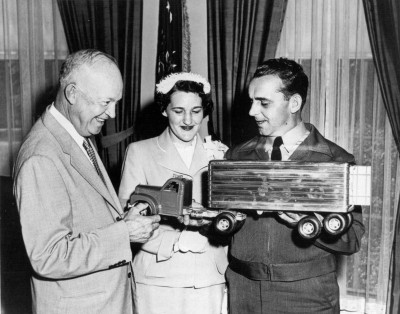 As part of his safety initiative, President Eisenhower met with Truck Driver of the Year Gomer W. Bailey and his wife in June 1954. The Baileys, of Denver, Colorado, presented the President with a model truck for his grandson David. The President and Mr. Bailey discussed highway safety and their shared passion for fishing in the fields and streams of Colorado. Mr. Bailey told reporters, "He's such a swell guy." (Courtesy Dwight Eisenhower Library)