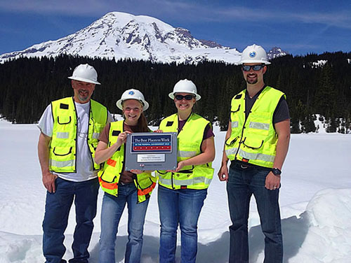 Western Federal Lands Highway Division staff pose with the Best Places to Work plaque at Mt. Rainier National Park, Washington