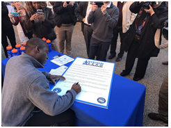 Richmond Major Levar Stoney signs a document making Richmond, Virginia, a Vision Zero city.