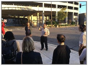 Photo shows John Landosky leading a walking tour.