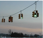 A signalized intersection featuring a flashing yellow arrow above the left-turn lane.