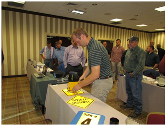 Luke Mantle, Road Supervisor with the Campbell County Road Department, tests a sign using the retroreflectometer