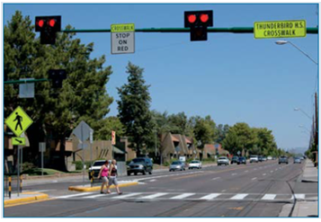 A pedestrian hybrid beacon at a mid-block crossing.