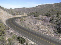 An an image of a valley with a road digitally added.