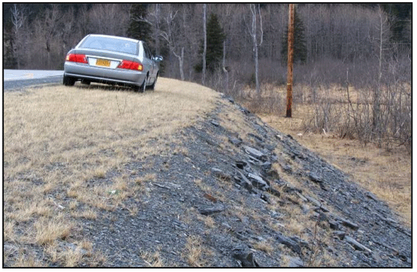 Photograph of a typical barnroof slope design. The slope on the outside of the curve is flattened and then breaks into a much steeper slope.