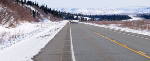 Photo of rural road in winter with rumble strips and striping.