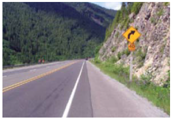 "A curving road in mountainous terrain"