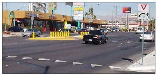 Photo of advance yield pavement markings and signage in advance of a crosswalk with a Danish offset.