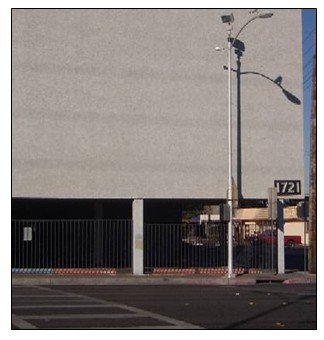 Photo of a pole-mounted dynamic light above an crosswalk.