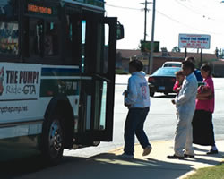 This photo shows people boarding a bus.