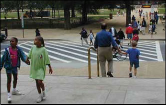 Photo: Pedestrains crossing at marked crosswalk