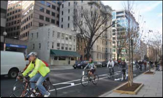 Photo: Bicycle facilities that run alongside a roadway separated from automobile traffic by a physical barrier