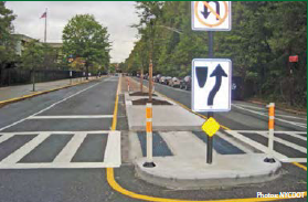 A pedestrian refuge island improves safety for pedestrians near Tottenville High School.