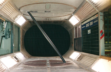 Shown here is a wind tunnel test by the laboratory's research partners at National Research Council Canada to measure wind pressures on a rigid model of an inclined cylinder representing a bridge stay cable. The researchers measured  pressures using taps at several circumferential rings along the length of the model. They varied the yaw angle (horizontal angle between the approaching wind and a vertical plane containing the cable) by rotating the model on a turntable.