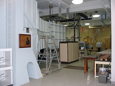 In the large, open-circuit wind tunnel (far left) in FHWA's Aerodynamics Laboratory at TFHRC, smooth and turbulent wind conditions are simulated during static and dynamic testing of structural models.