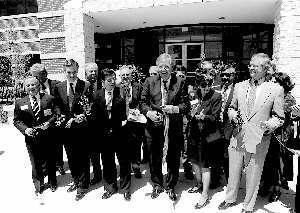 From the left: Houston Metro Chairman Billy Burge, Harris County Judge Robert Eckels, U.S. Tranportation Secretary Federico Pena, Houston Mayor Bob Lanier, Houston City Council member Helen Huey, and Texas Transporation Commissioner David Laney cut ribbon to open Houston's traffic management system, Houston TransStar.