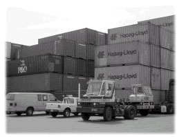 A freight hub shown with cargo boxes and trucks