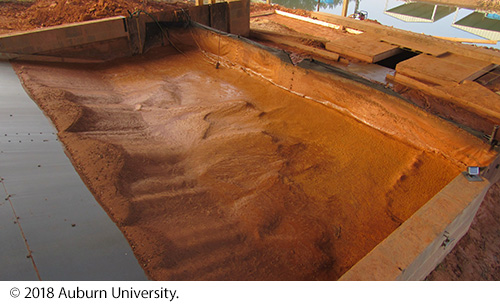 A rear-view of the silt fence with a large collection of sediment. Image Source: © 2018 Auburn University.