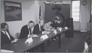 Signing landmark environmental agreement. From left to right: Jon Rittgers, Ronald Lambertson, Edwin Erickson, FHWA Regional Administrator David Gendell, and General Gerald Brown.