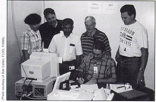 FHWA's disaster field office in the former Eastern Airline building at Miami International Airport. From left to right: Jennifer Balis (NE), Don Blankenship (AL), Pram Booncharoen (MI), Tom Pilling (KY), (foreground) Greg Schiess (FL), and Pete Hartman (ID).