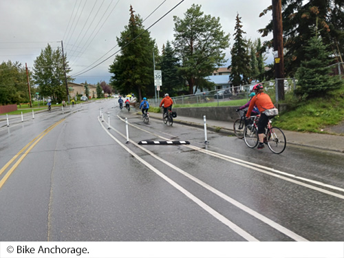 Cyclists travel on both sides of a roadway in lanes designated for bike riding. Image: © Bike Anchorage.. Image: © Bike Anchorage.