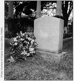 A leader's epitaph: "Logan Waller Page - 1870-1918 - Pioneer in the Science of Road Building in the United States-Creator and First Director of the Federal Office of Public Roads-Benefactor of All Who Use American Highways." (Flowers placed by Administrator Rodney Slater, April 21, 1995).