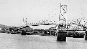 The U.S. 35 Silver Bridge, completed in 1928 (top) and following its collapse, a view from the Ohio side.