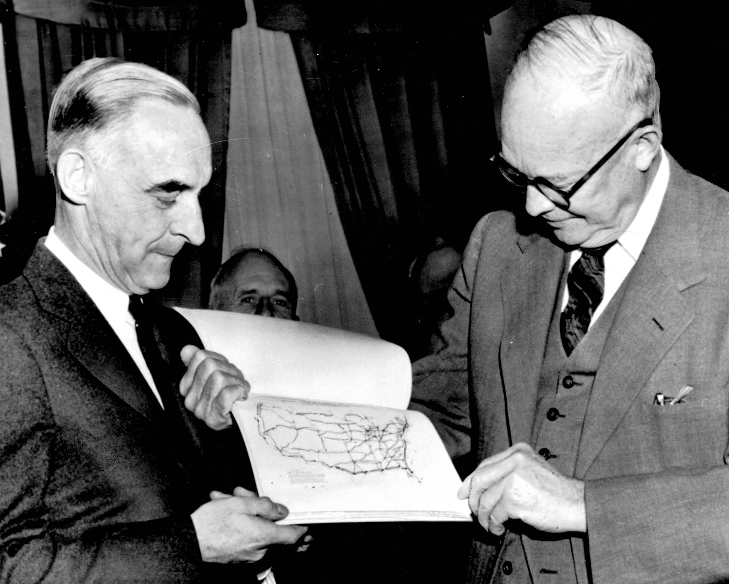 President Eisenhower and General Lucius D. Clay look at a map