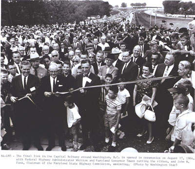 Capital Beltway - Maryland - The final link in the Capital Beltway around Washington, D.C. is opened in ceremonies on August 17, 1964, with Federal Highway Administrator Rex Whitton and Maryland Governor Millard Tawes cutting the ribbon, and John B. Funk, Chairman of the Maryland State Highway Commission, assisting. (Photo by Washington Star)