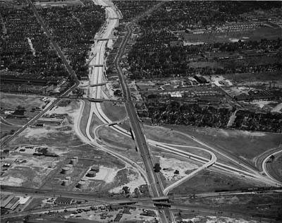 Ford Expressway. Michigan Avenue interchange in foreground. McGraw Ave on left and Michigan Avenue on right of Ford Expressway. Wyo ming Ave is under RR track crossing and intersects Mich Ave at grade in foreground