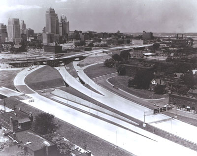 Missouri - The Kansas City central business district, looming in the distance above, is shown close up below, served by the Inner loop section of I-70. (Construction was underway at the time of this photograph.)