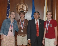 On June 17, Secretary of Transportation Norman Y. Mineta congratulated Silver Medalists Tatum Holland, Justine Rice, and Brittany Rice (left to right) for their success in the National History Competition.