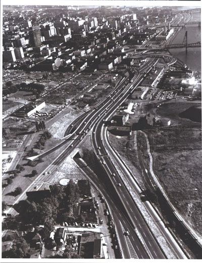 Oregon - A connecting link from Interstate Route 5 (on the right) joins Harbor Drive at the edge of downtown Portland. An area prepared for urban re-development appears at the upper left.