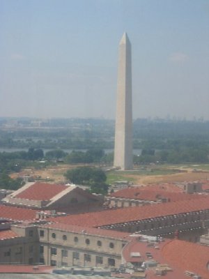 From the Bell Tower of the Old Post Office Building, a visitor has one of the best views of Washington, DC. The Washington Monument is nearby, with the Lincoln Memorial just beyond it in this photograph. Just beyond the Lincoln Memorial across the Potomac River is Arlington National Cemetery. Arlington House is visible on the hill to the left of the Lincoln Memorial.