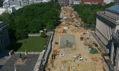 Pennsylvania Avenue from 15th to 17th Streets is being reconstructed, as shown here. In the foreground, a statue of Albert Gallatin, a former Secretary of the Treasury (1801 to 1814), sits in front of the Treasury Building. The top of White House is visible behind the line of trees. (Photo courtesy Eastern Federal Lands Highway Division)