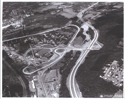 Pennsylvania - North Scranton - triple trumpet interchanges link Interstate Route 81, on the right side of the picture, U.S. Routes 6 & 11, at the lower left and the northern terminus of the Northeast Extension of the Pennsylvania Turnpike, which comes in from the left on a high viaduct (parallelling U.S. Routes 6 & 11 in the lower left is a railroad.)