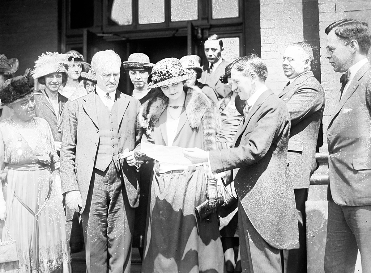 Harvey S. Firestone presenting the award to Miss Butterfield