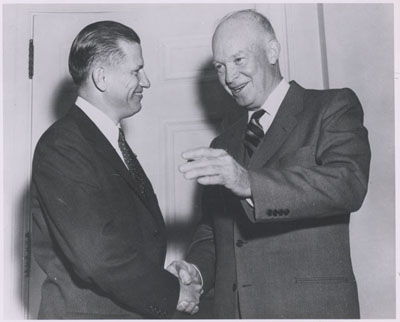 The first Federal Highway Administrator John A. Volpe with President Dwight D. Eisenwhower at the White House on October 22, 1956.