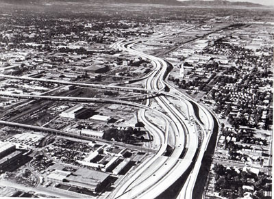 Work on this section of Interstate Routes 15 and 80, leading into Salt Lake City, Utah, from the north, began in 1958. The elevated roadways leading off to the left are spur routes to the central city. (Project I-15-7(23), (34), (46), & (51).)