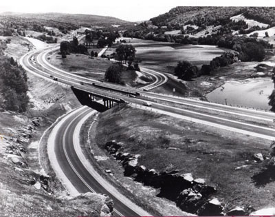 I-89 looking easterly up the Winooski River valley. Interstate overpasses relocated US-2 in center of photograph, approximately 2 3/4 miles west of the village of Waterbury.