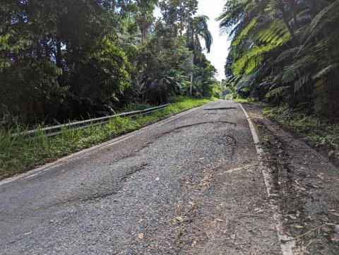 Photo of General Pavement Condition showing asphalt road that is severely deteriorated with large pot holes